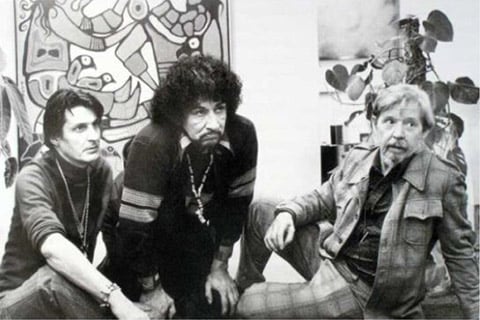 Picture of Selwyn Dewdney sitting, in the company of artists Jack Pollock and Norval Morrisseau