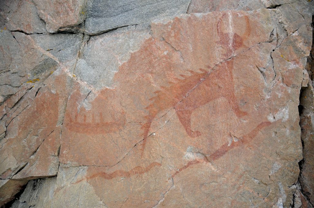 Image of rock paintings at Agawa Bay that represent a canoe and underwater creatures, Mishipeshu, or Great Lynx, and snakes.